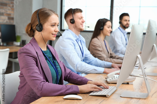 Technical support operators working in modern office