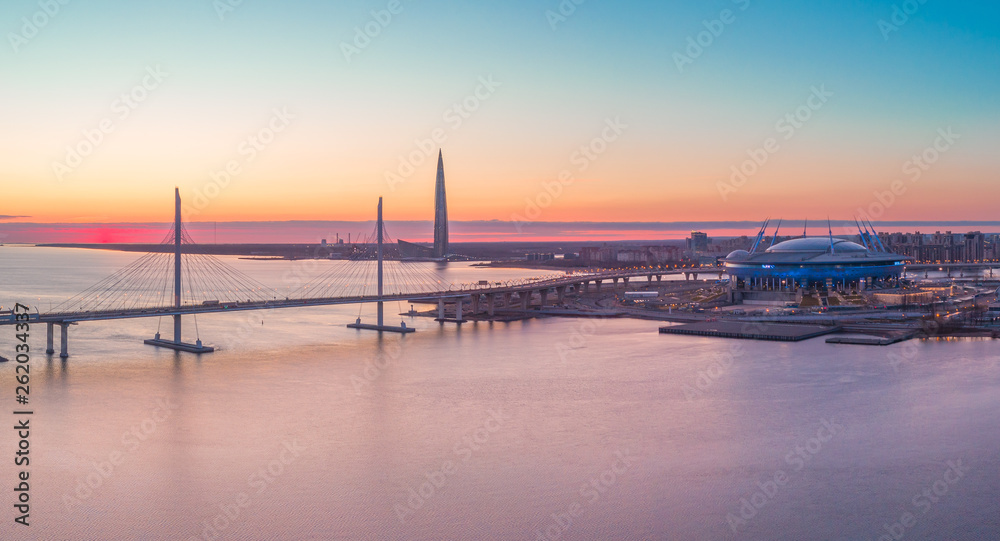 The cable-stayed bridge is the western high-speed diameter, and the tallest skyscraper in Europe - Lakhta center at sunset. Russia. Saint-Petersburg. 14 April 2019.