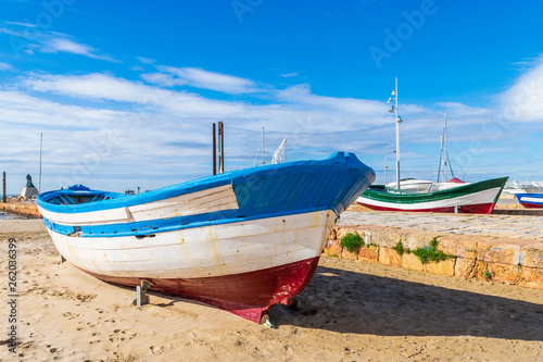 Fishing boats at the beach in Salou photo