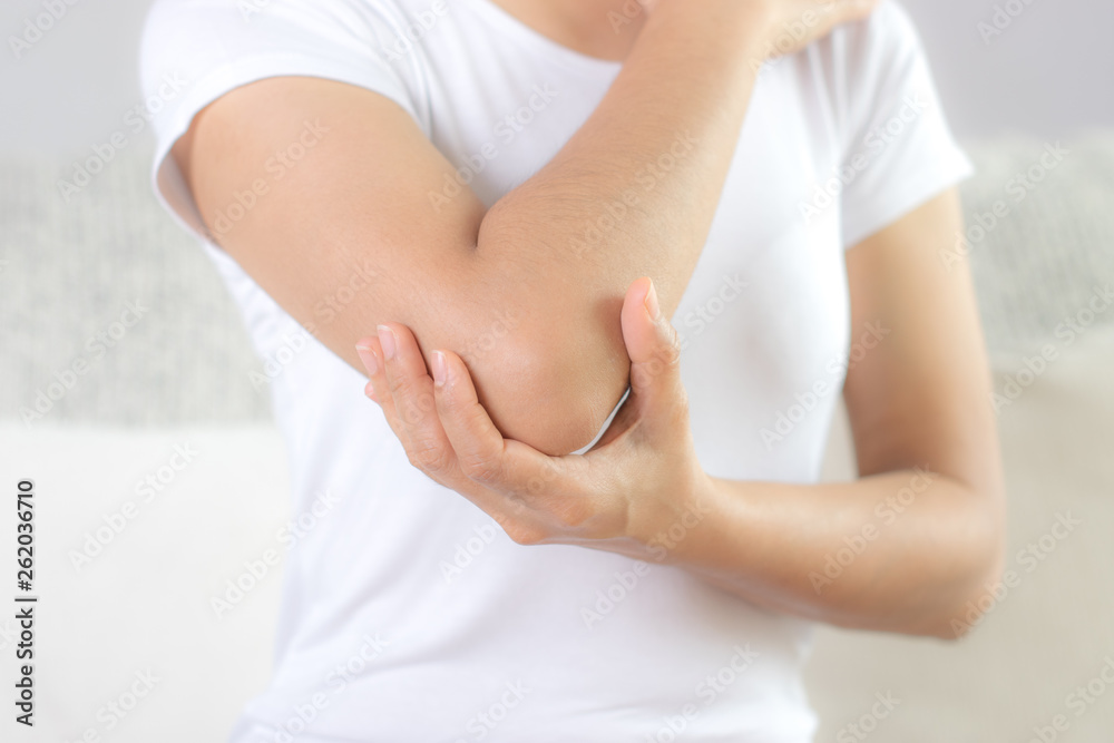 custom made wallpaper toronto digitalClose up woman having pain in injured elbow. Health care and arm pain concept.
