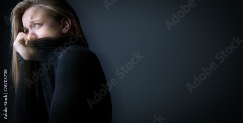 Young woman suffering from a severe depression/anxiety photo