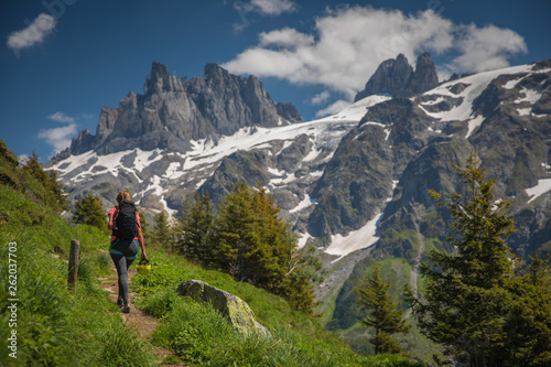 Fotografie Pretty, female hiker/climber in a lovely alpine setting of Swiss Alps