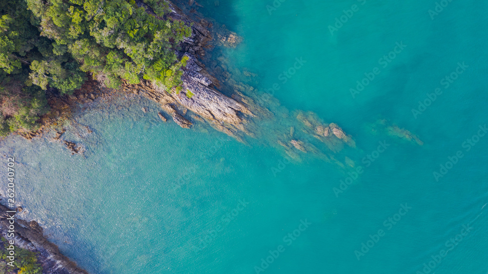 Aerial view photo, Tropical beach with ocean and rock on the island