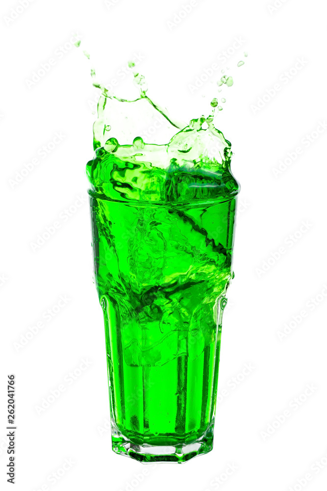 Green soda splashing out of glass isolated on white background. Green soda splashing out of glass isolated on white background.