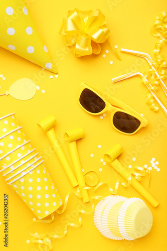 Birthday party decorations on yellow background. Minimalism concept