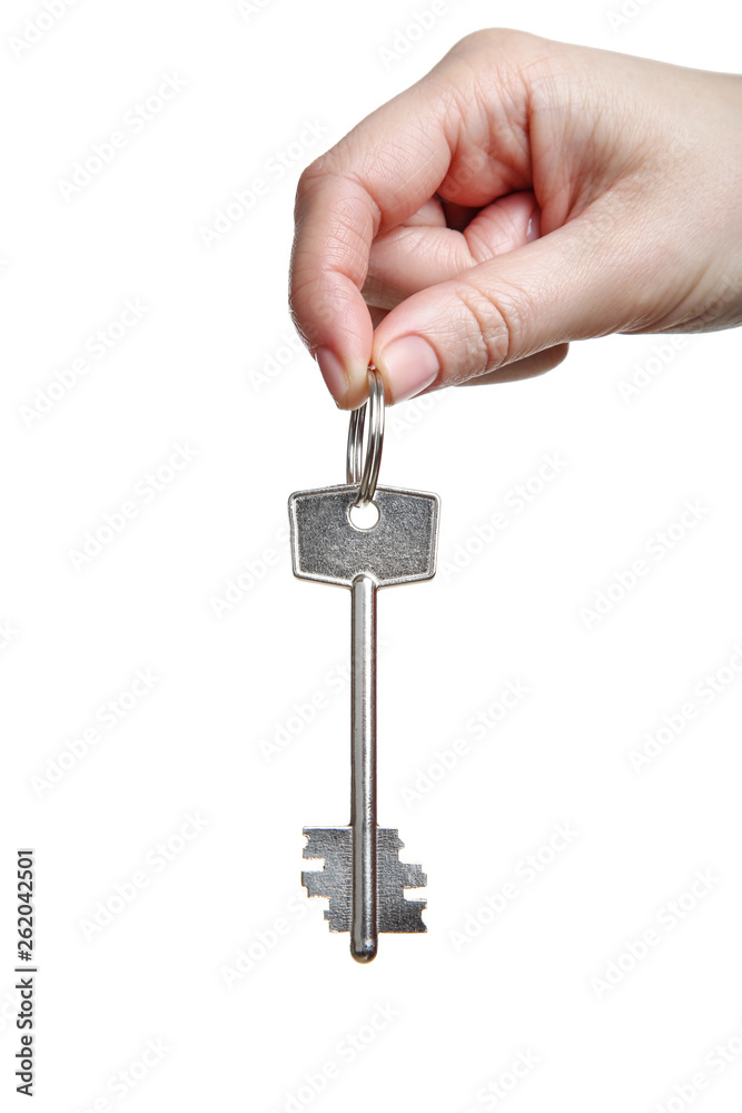 Female hand holding house key on white background Female hand holding house key on white background