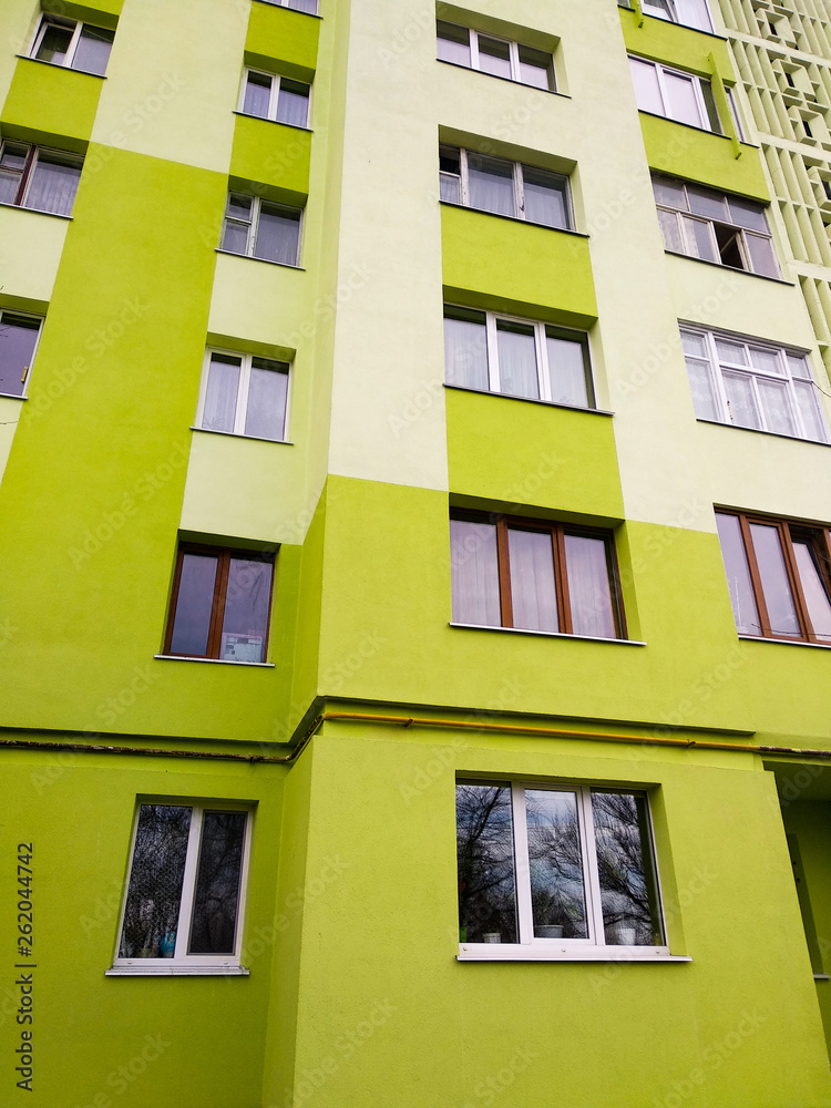 Fototapeta premium Modern panel apartment building with plastic windows and insulated walls