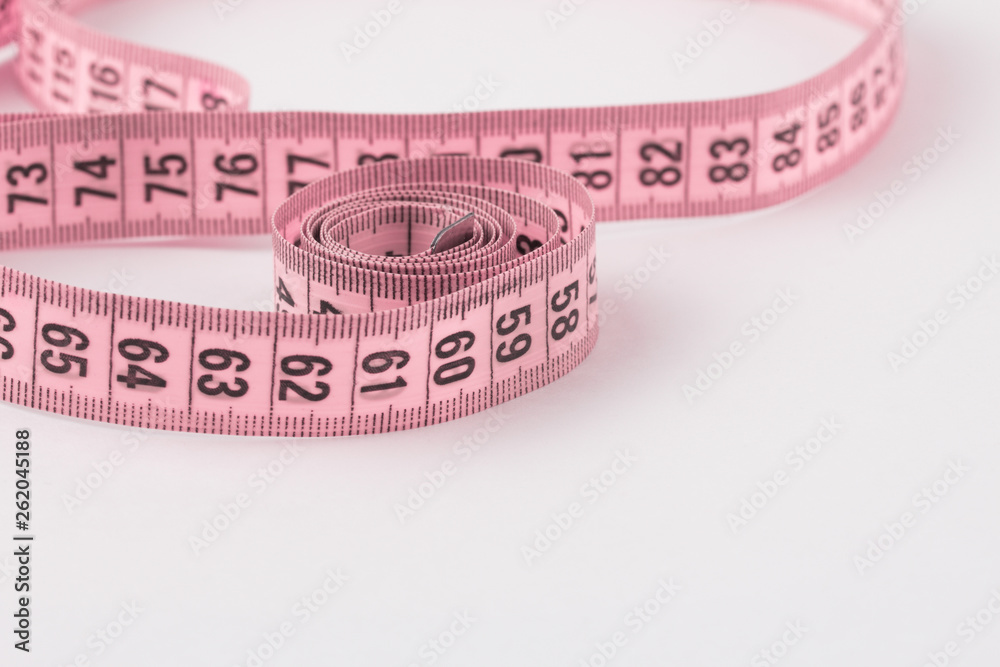 Flat lay composition with measuring tape. Slimness concept Flat lay composition with measuring tape. Slimness concept