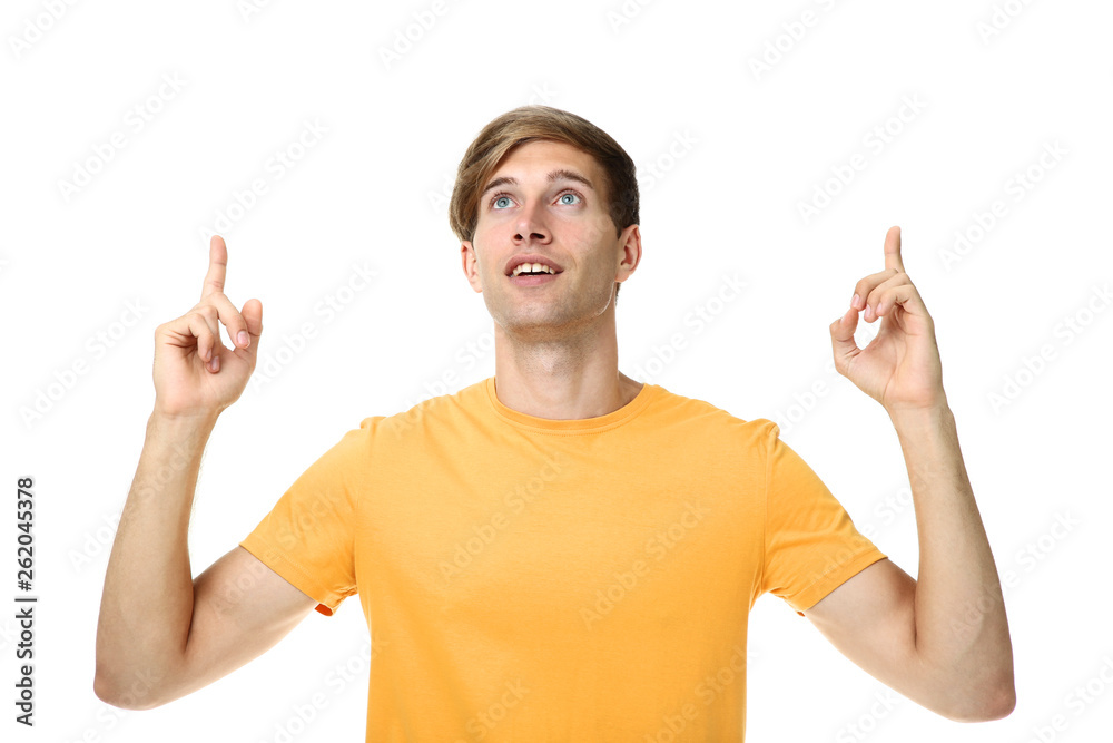 Beautiful young man in yellow t-shirt isolated on white background Beautiful young man in yellow t-shirt isolated on white background