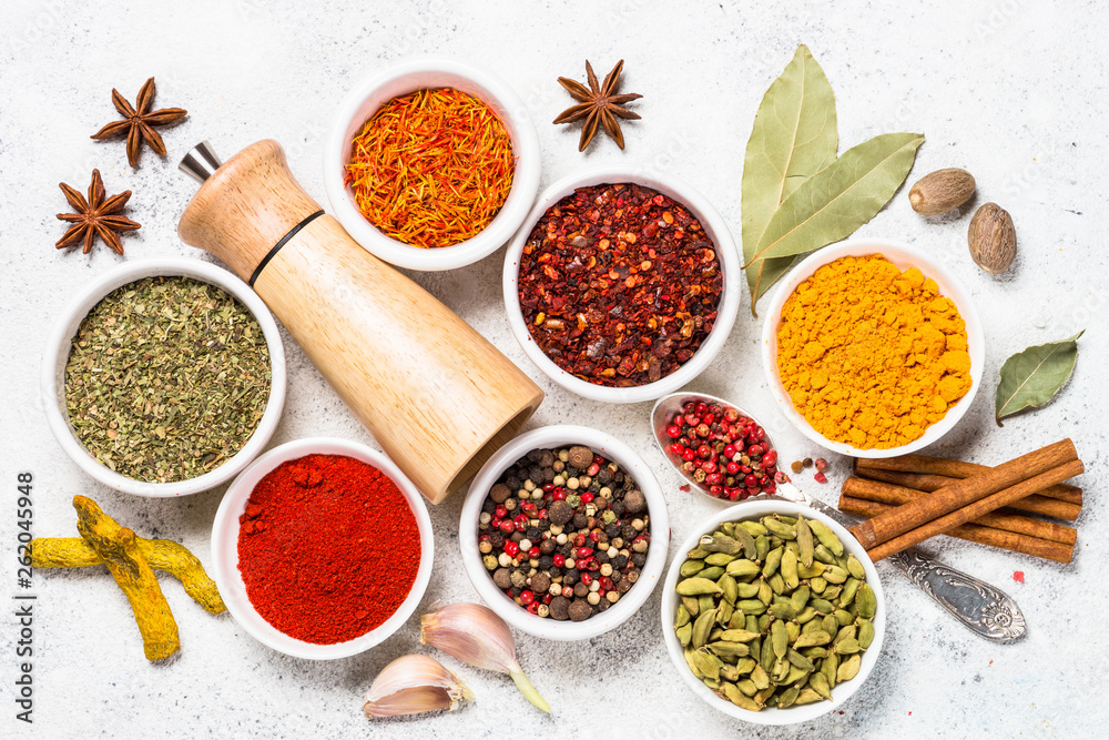 Spices on white stone table.