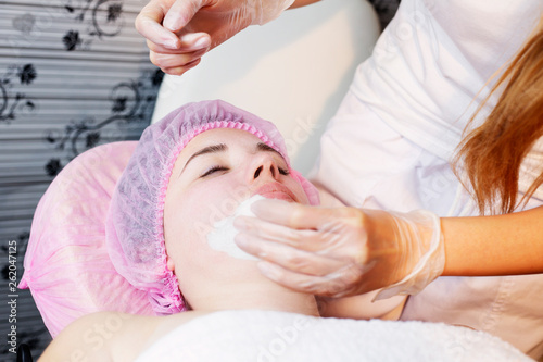 Woman in spa salon lying down and enjoy relaxing in the day spa. Different treatments at the spa