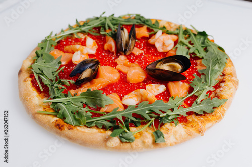 Pizza with red caviar and mussels
