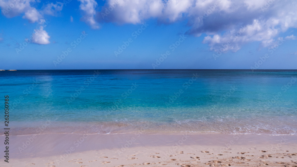 Beautiful day at the beach with passing clouds over the Atlantic Ocean. Nassau, The Bahamas.