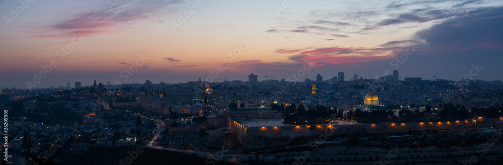 Beautiful aerial panoramic view of the Old City, Dome of the Rock and Tomb of the Prophets during a dramatic sunset. Taken in Jerusalem, Capital of Israel.