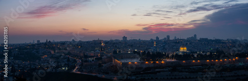 Fototapeta Naklejka Na Ścianę i Meble -  Beautiful aerial panoramic view of the Old City, Dome of the Rock and Tomb of the Prophets during a dramatic sunset. Taken in Jerusalem, Capital of Israel.