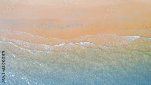 Aerial view of Beach with shade emerald blue water and wave foam on tropical sea