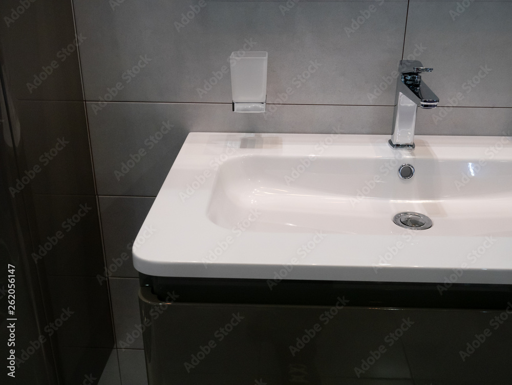 moder washbasin at hotel room in dim light moder washbasin at hotel room in dim light