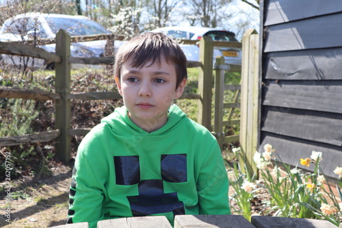 Boy wearing Minecraft hoody at farm 