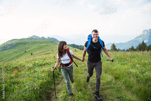 Hiking couple running at mountain,have fun