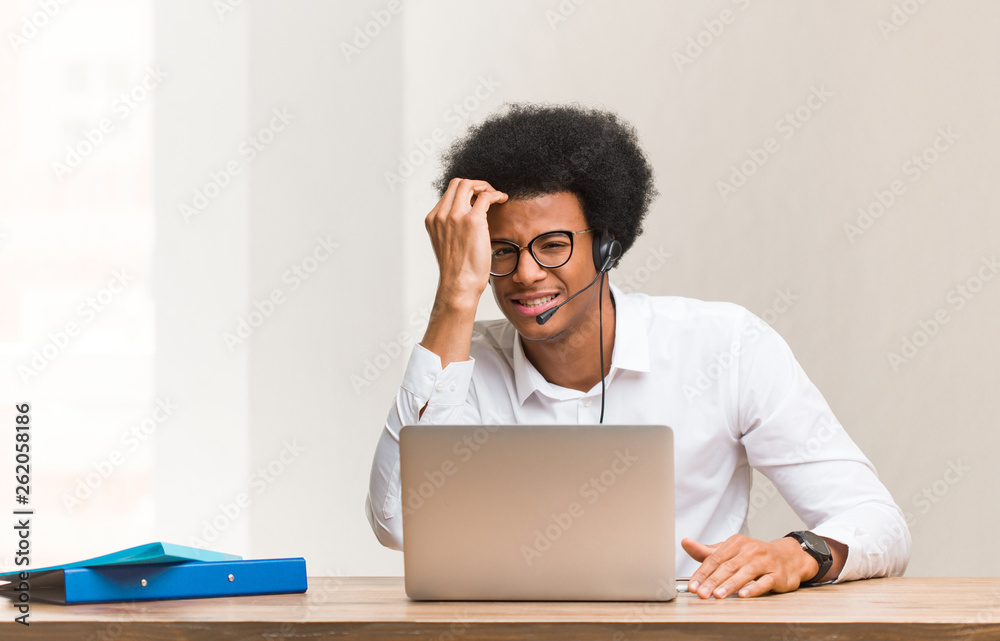 Young telemarketer black man tired and very sleepy Young telemarketer black man tired and very sleepy