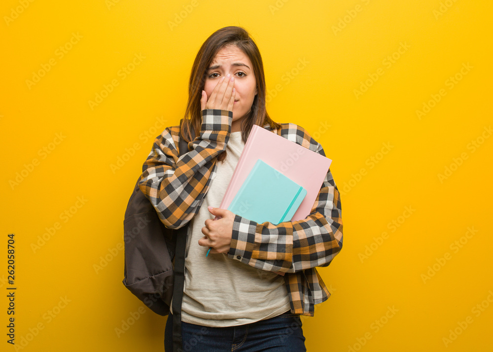 Young student woman very scared and afraid hidden Young student woman very scared and afraid hidden