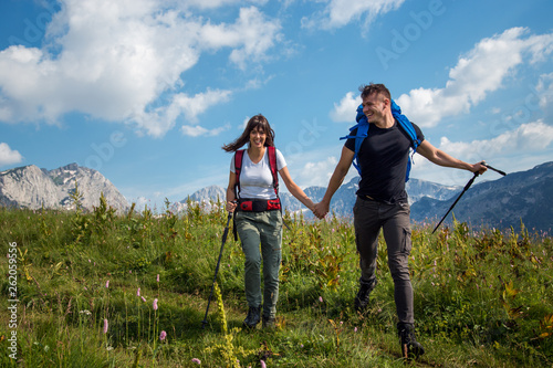 Couple with backpack enjoying at hike trip