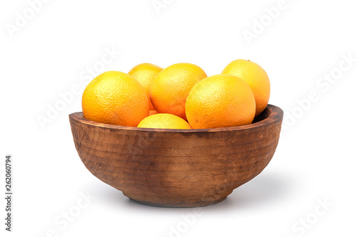 Wooden bowl of oranges on white background