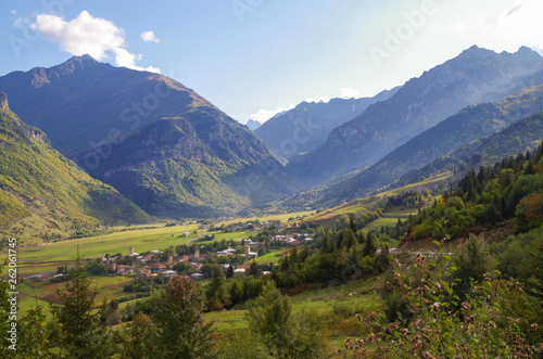 Scenic autumn landscape in the mountains of the Caucasus. View of the valley and village with ancient Svan towers. Nature and travel. Georgia, Svaneti region © Marisha_SL