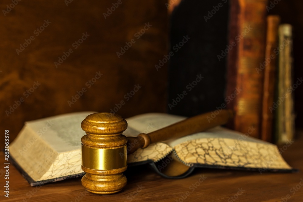 Wooden judge gavel, close-up view. Judge's gavel on table. Law and order. Law and justice concept.