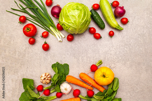 Assortment fresh organic vegetables. Food cooking stone background. Healthy vegetarian (vegan) eating concept, top view, flat lay.