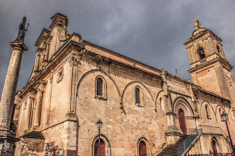 Vizzini, Sicily, Italy: HDR main historic church of Vizzini, front and side view, the beauty of its characteristic baroque architecture with sky in background
