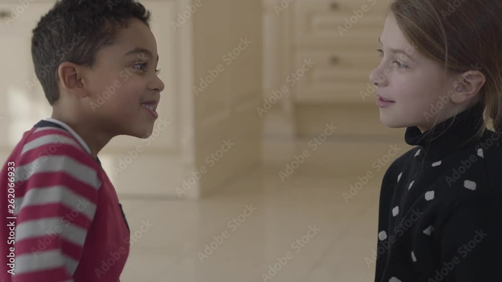 Portrait of cute adorable african american boy and pretty blond caucasian girl. Portrait of cute adorable african american boy and pretty blond caucasian girl.