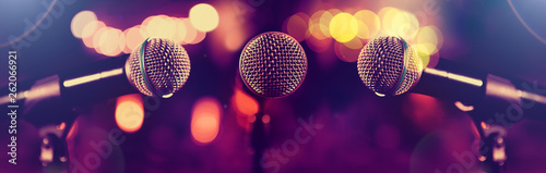 Microphone and stage lights.Concert and music concept.Live music and conference background.Karaoke and entertainment concept.