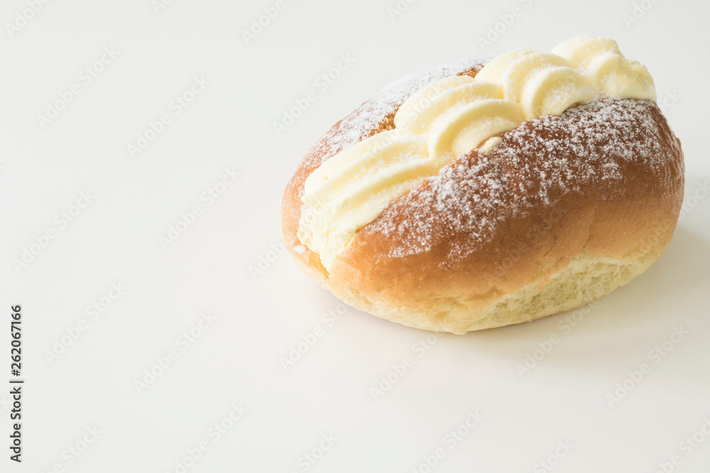 typical Dutch creamed sandwich called roombroodje or puddingbroodje. Against white background. copy space