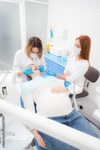 pregnant woman in dentist office, dental treatment for pregnant women