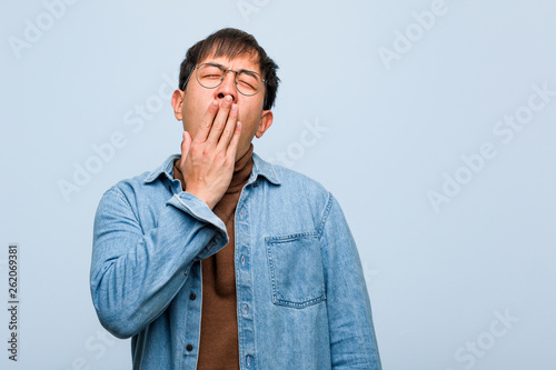 Young chinese man tired and very sleepy