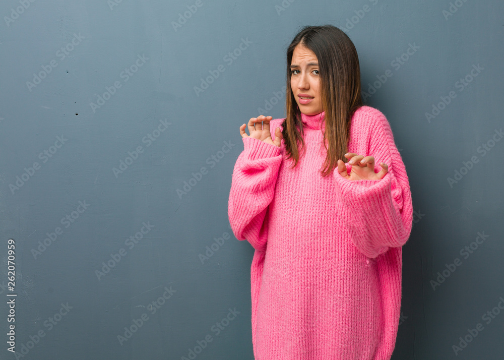 Young modern woman rejecting something doing a gesture of disgust Young modern woman rejecting something doing a gesture of disgust