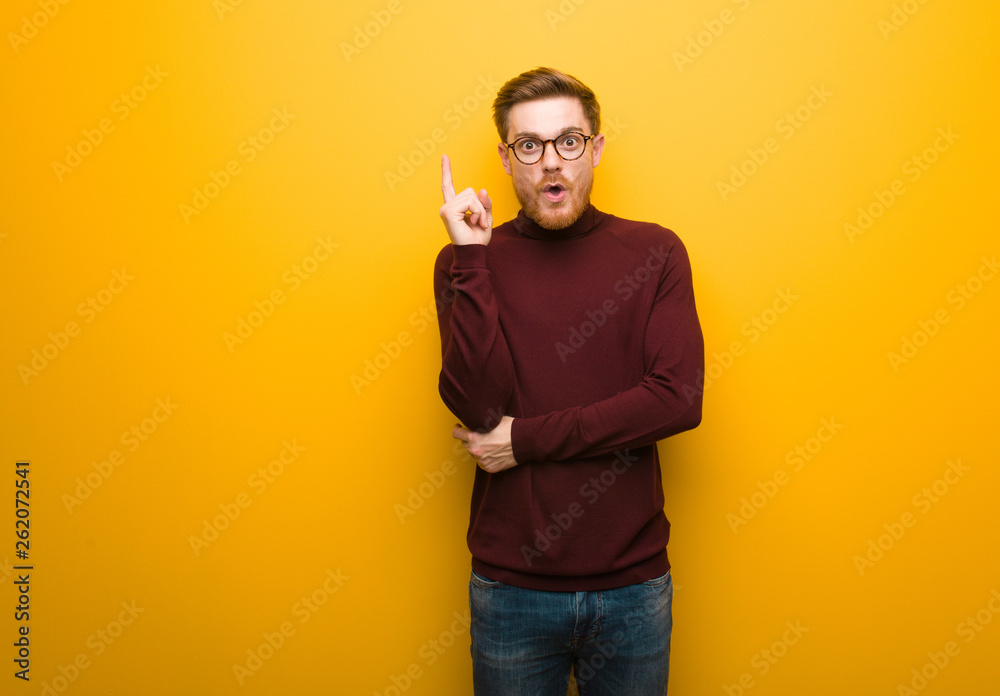 Young smart man having a great idea, concept of creativity Young smart man having a great idea, concept of creativity
