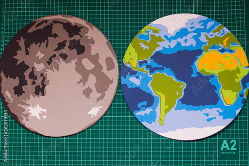 making paper mockup of the moon and earth