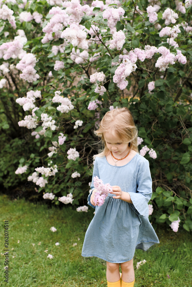 Portrait of smiling girl with lilac blossoms Portrait of smiling girl with lilac blossoms