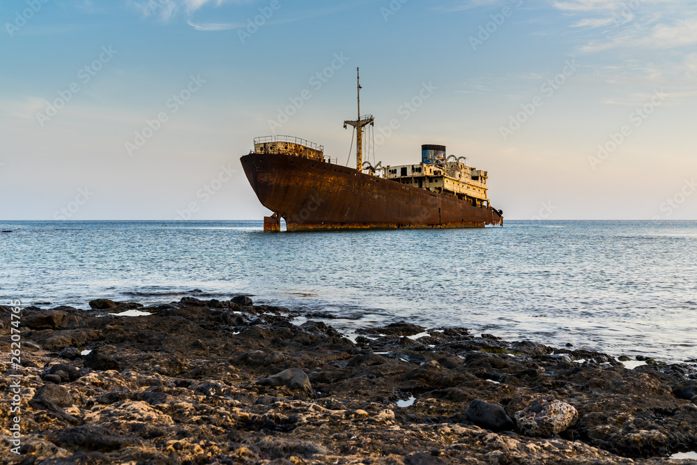 Spain, Lanzarote, Rusty stranded shipwreck at coast of arrecife