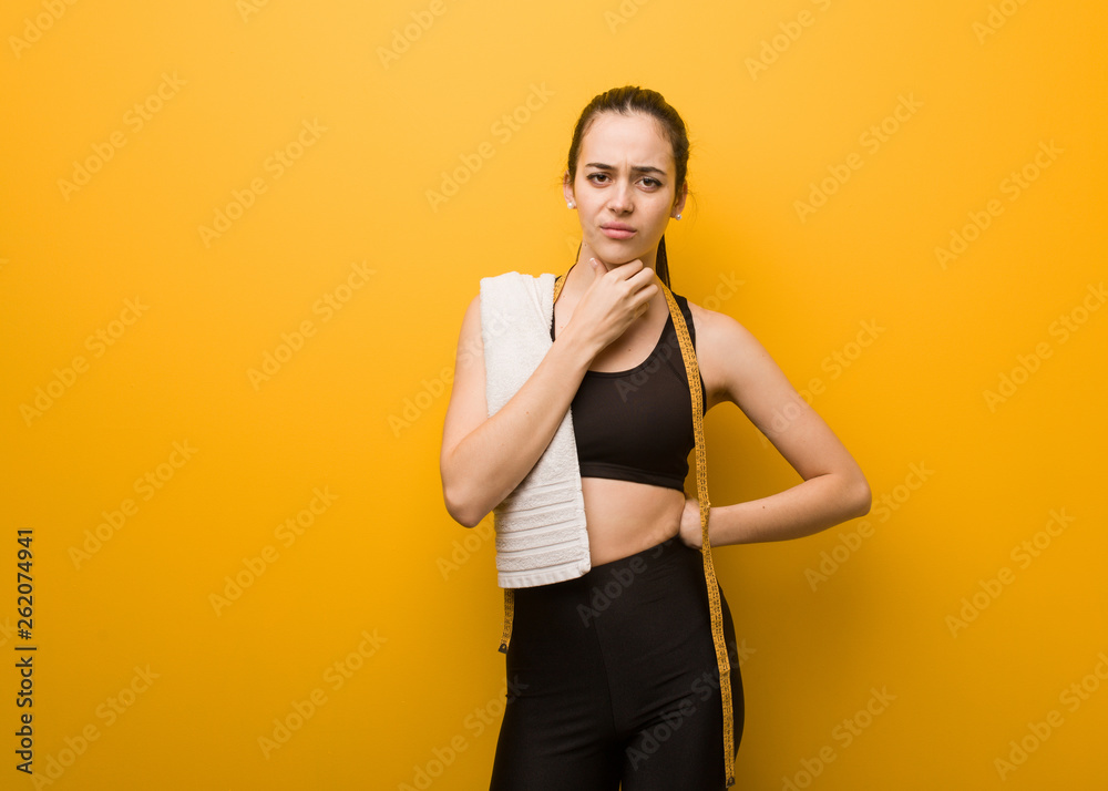 Young fitness girl coughing, sick due a virus or infection Young fitness girl coughing, sick due a virus or infection