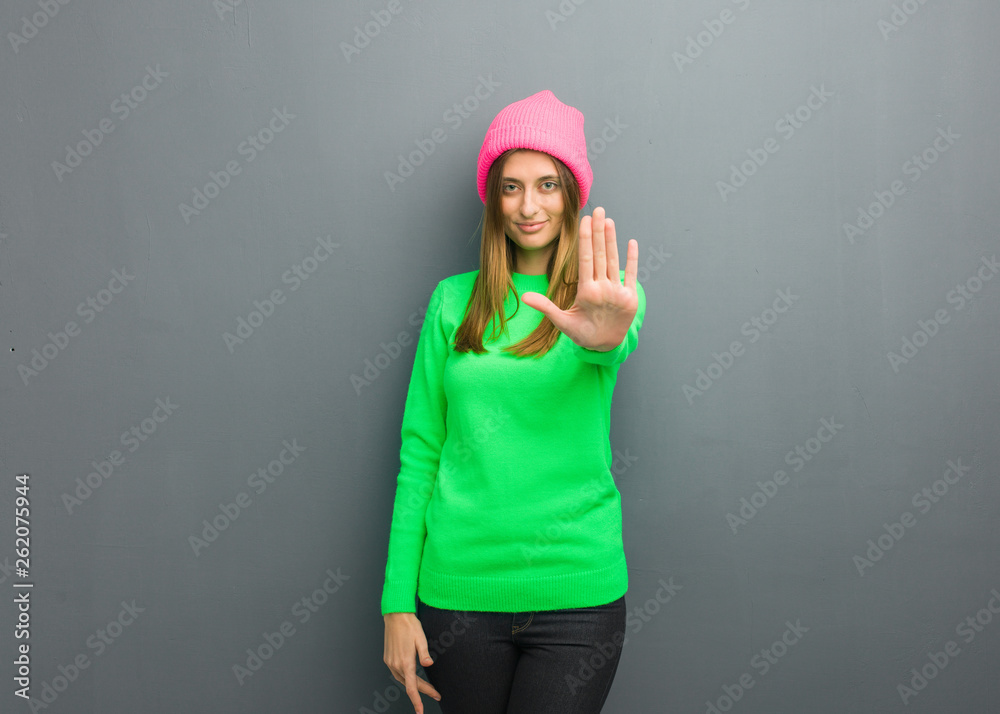 Young natural russian girl putting hand in front