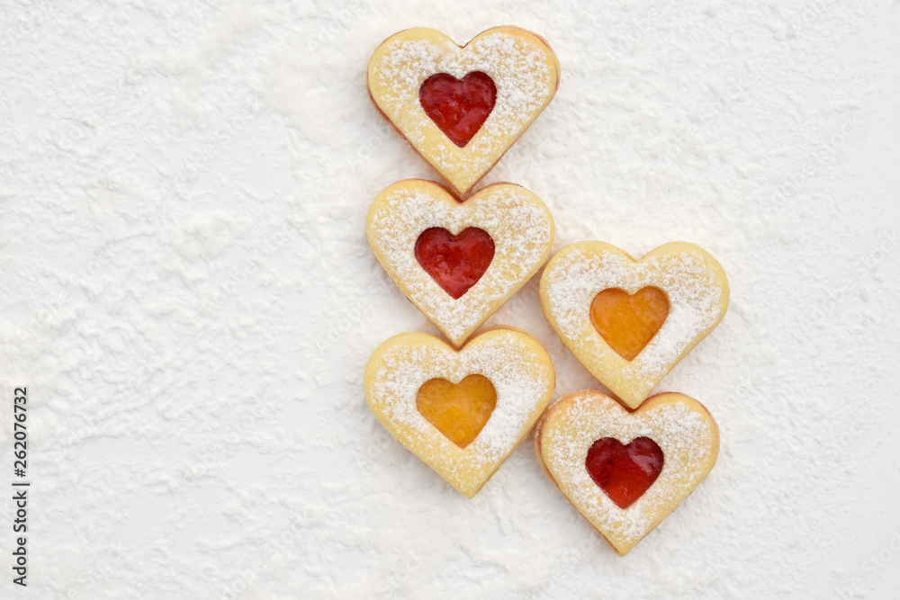 Fototapeta premium Homemade linzer cookies filled with strawberry and apricot jam