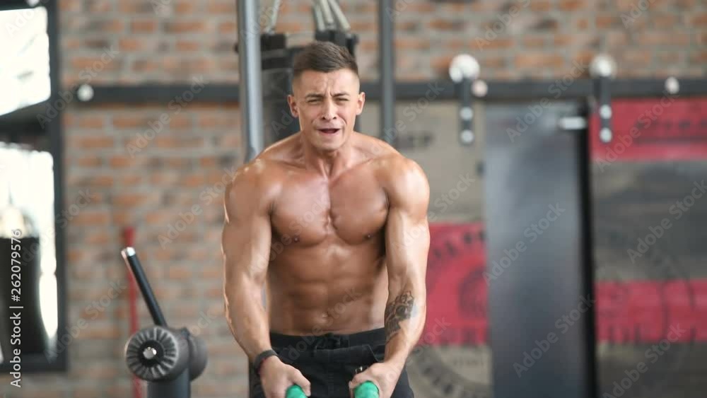 fitness athletes training using battle ropes intense workout team exercise challenge in gym enjoying healthy bodybuilding endurance practice lifestyle together fitness athletes training using battle ropes intense workout team exercise challenge in gym enjoying healthy bodybuilding endurance practice lifestyle together