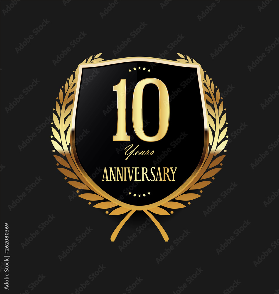 Fototapeta premium Golden shield and laurel wreath anniversary retro design 10 years