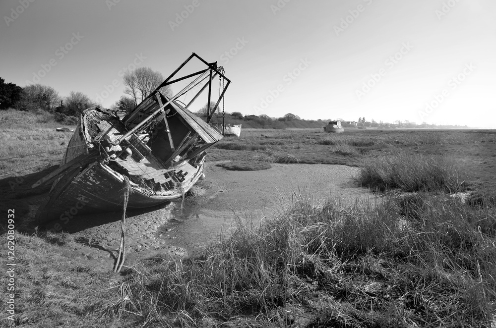 Old trawler final resting place at low tide on Heswall shore