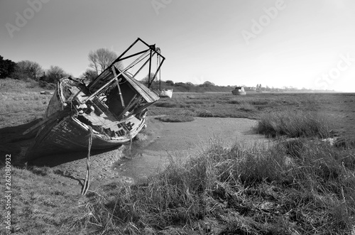 Old trawler final resting place at low tide on Heswall shore
