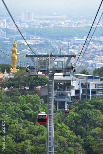 View of the sky-high cable car of Hat Yai, looking like a Buddha image and the city.	