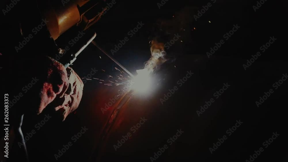welder welding the metal part